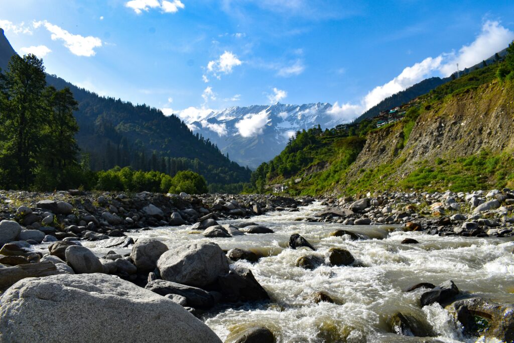 pexels photo 15146122 15146122 Flowing river through rocks with mountain backdrop in Manali, India