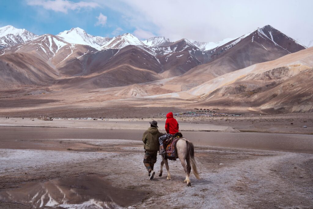 pexels photo 34998312 34998312 1 A person and child riding a horse in the breathtaking mountains of Ladakh, India.